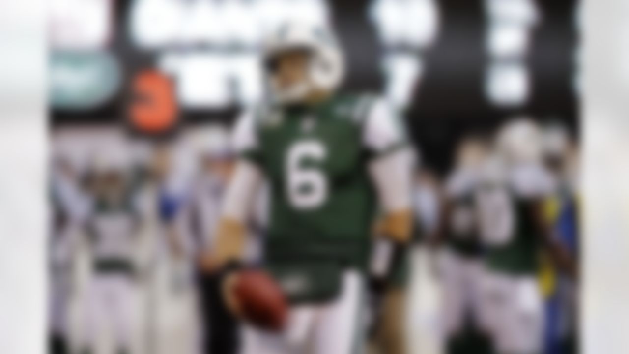 New York Jets quarterback Mark Sanchez reacts during the third quarter of an NFL football game against the New York Giants Saturday, Dec. 24, 2011, in East Rutherford, N.J. (AP Photo/Julio Cortez)