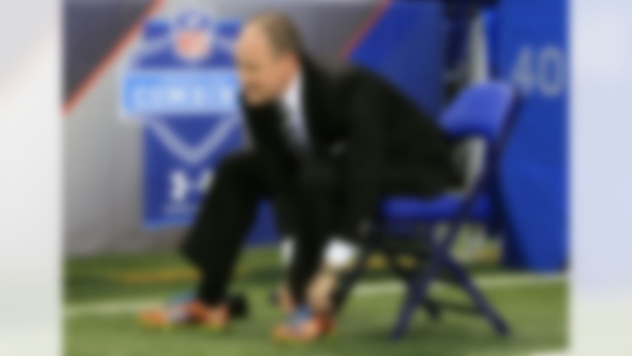 NFL Network host Rich Eisen puts on his running shoes before his 40 yard dash run at the 2012 NFL Scouting Combine at Lucas Oil Stadium on Feb. 27 in Indianapolis, Ind. (Ben Liebenberg/NFL)