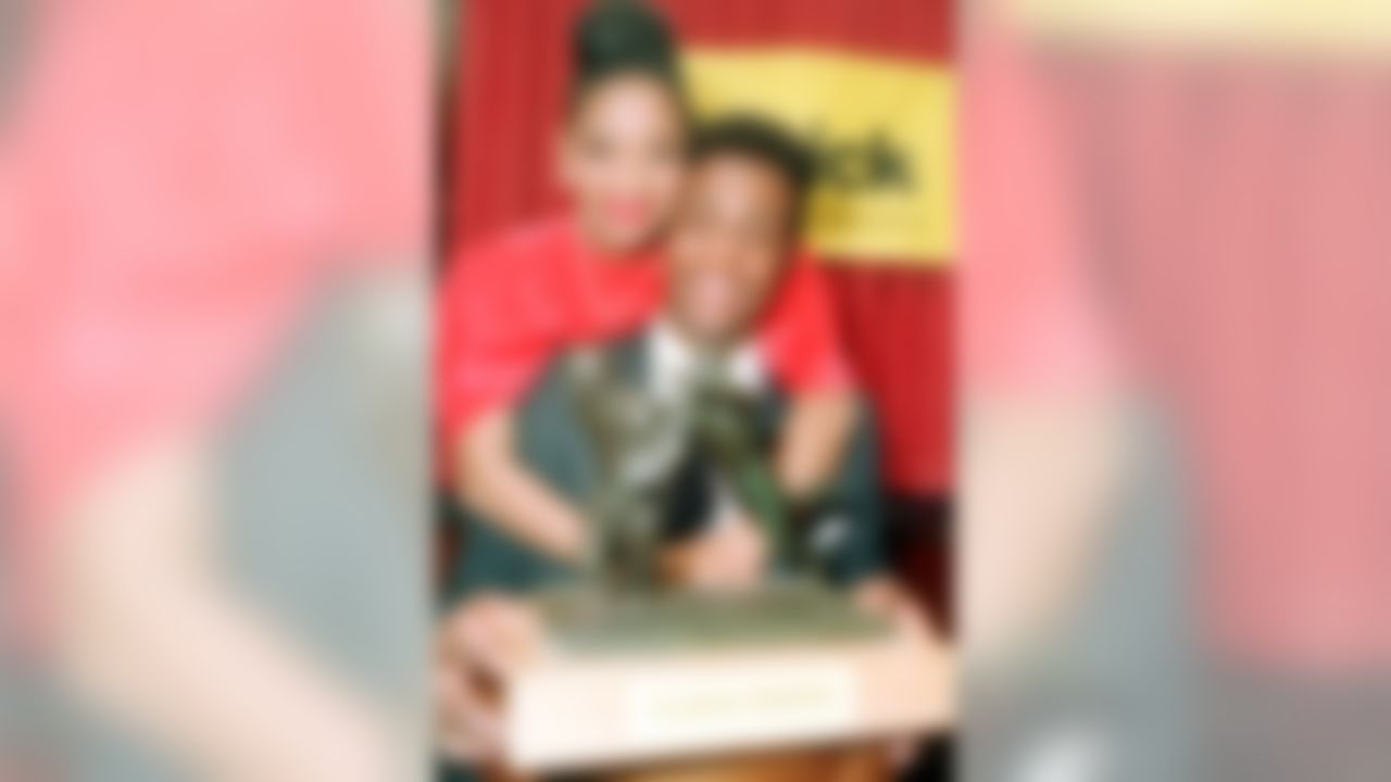 San Francisco 49ers Jerry Rice poses with his wife, Jackie, after he was presented the Schick Trophy in New York City, Jan. 19, 1988. The Schick Trophy is presented annually to the National Football League's Most Valuable Player. (AP Photo/Marty Lederhandler)