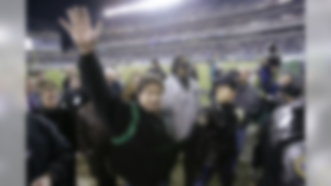 Actor Sylvester Stallone waves from the sideline before the Carolina Panthers and Philadelphia Eagles football game Monday, Dec. 4, 2006, in Philadelphia. (AP Photo/Matt Rourke)