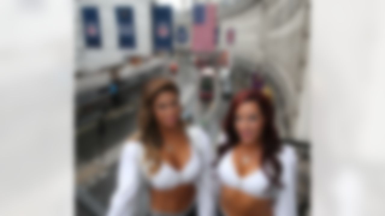 The Raiderettes, Oakland Raiders cheerleaders, pose for a photograph on Regent Street on Wednesday, September 24, 2104 in London. (Dave Shopland/NFL)