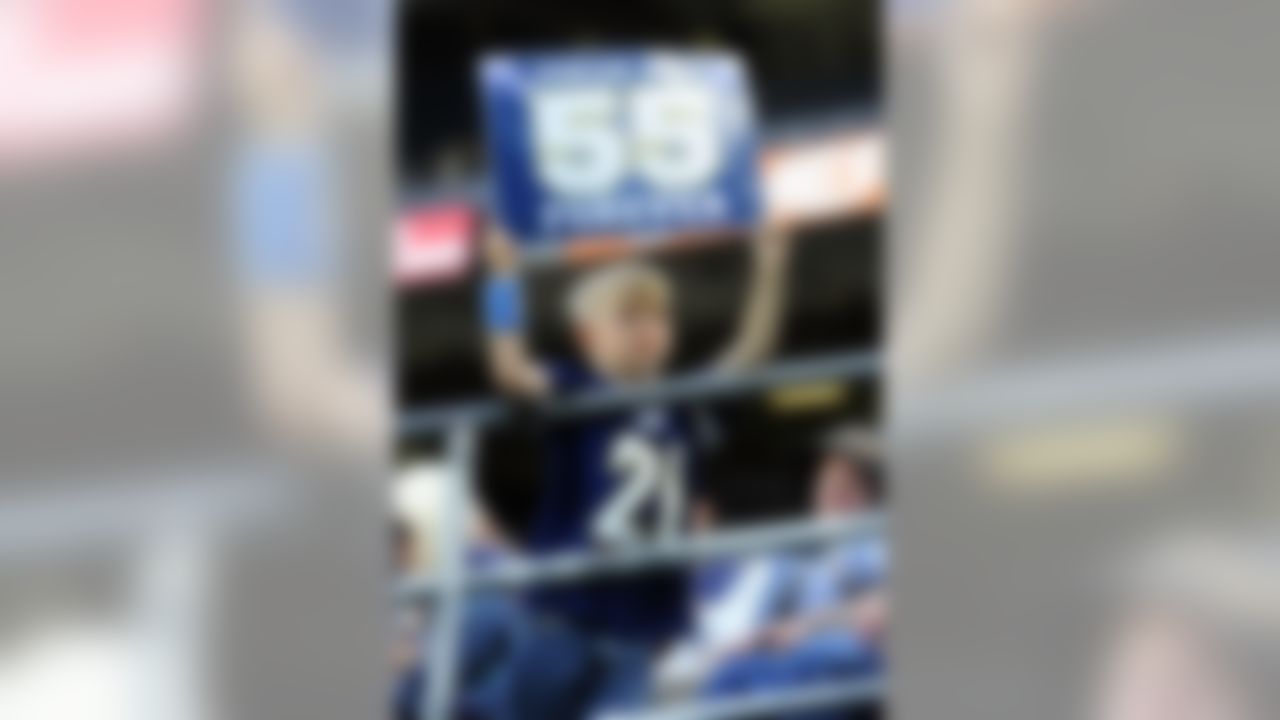 May 11, 2012; San Diego, CA, USA; Zach Thomason, 6, displays a Junior Seau sign before a celebration of life service at Qualcomm Stadium. Mandatory Credit: Christopher Hanewinckel-US PRESSWIRE