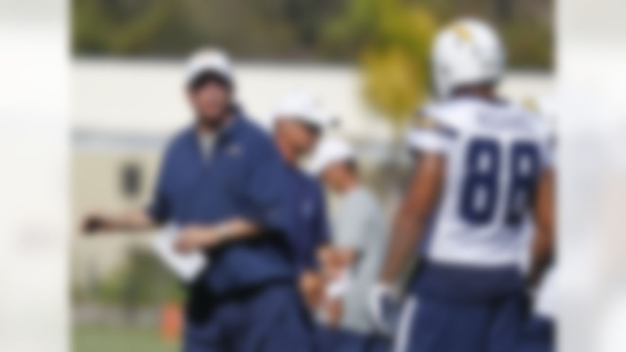 San Diego Chargers coach Norv Turner works with receiver Dante Rosario on his passing route during practice at NFL football training camp, Thursday, July 26, 2012, in San Diego. (AP Photo/Lenny Ignelzi)