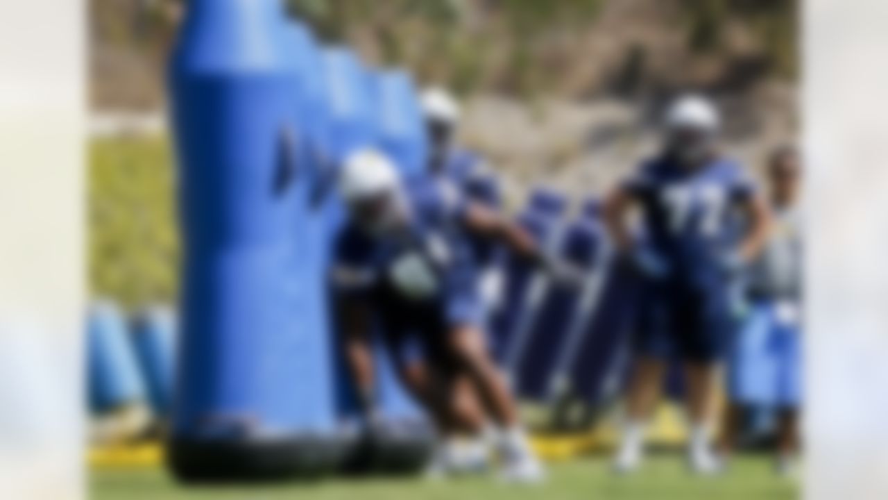 San Diego Chargers defensive end Kendall Reyes (91) races through a roll of blocking dummies during NFL football practice at the team's training camp, Tuesday, July 24, 2012 in San Diego. (AP Photo/Lenny Ignelzi)