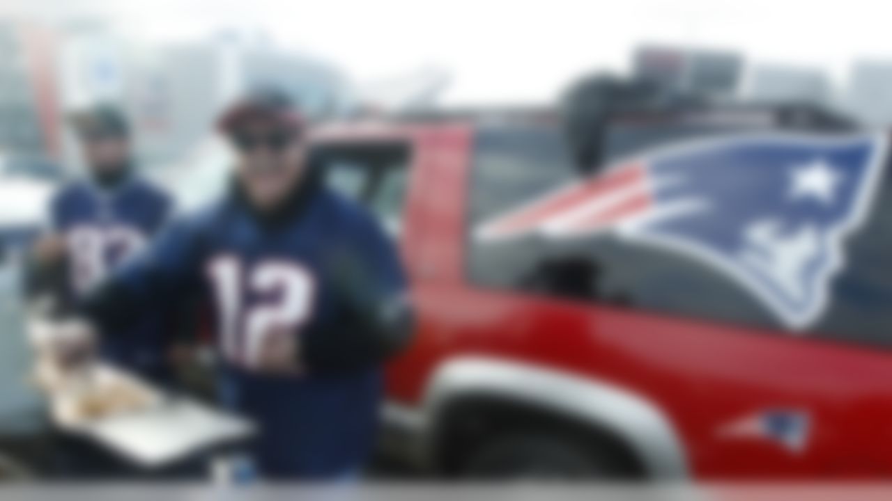 Bill Dame, of Berwick, Maine mans the grill while tailgating prior to an NFL football game between the New England Patriots and Indianapolis Colts in Foxborough, Mass., Sunday Dec. 4, 2011. (AP Photo/Charles Krupa)