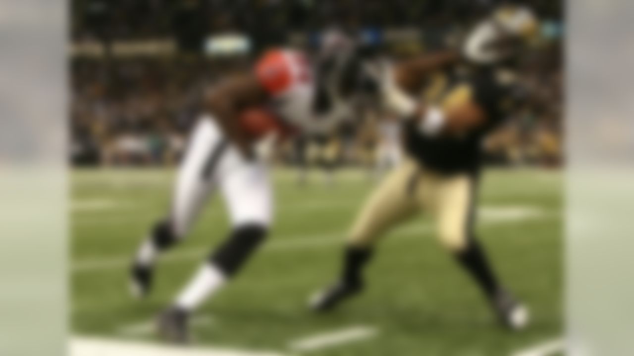 NEW ORLEANS - OCTOBER 21: Wide receiver Roddy White #84 of the Atlanta Falcons is pushed out of bounds by cornerback Mike McKenzie #34 of the New Orleans Saints at the Superdome on October 21, 2007 in New Orleans, Louisiana. (Photo by Doug Benc/Getty Images)