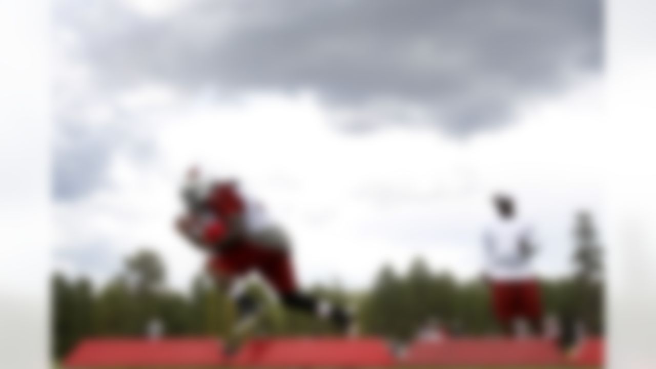 Arizona Cardinals' Ryan Williams runs agility drills with other offensive backs during the first day of NFL football training camp at Northern Arizona University, Wednesday, July 25, 2012, in Flagstaff, Ariz. (AP Photo/Ross D. Franklin)