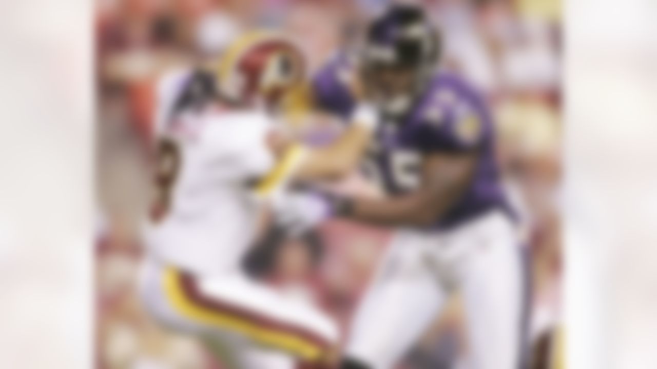 Washington Redskins quarterback Mark Brunell, left, is pressured by Baltimore Ravens' Terrell Suggs after throwing a pass during the first quarter of an NFL preseason football game, Thursday, Aug. 31, 2006, in Landover, Md. (AP Photo/Pablo Martinez Monsivais)