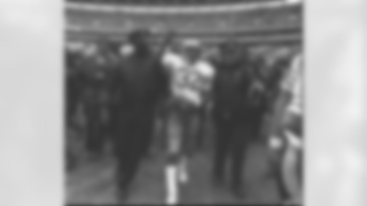 San Francisco 49ers running back O.J. Simpson is escorted from the field by Atlanta Police following an NFL football game at Atlanta Fulton County Stadium, in this Dec. 16, 1979 photo. (Associated Press)