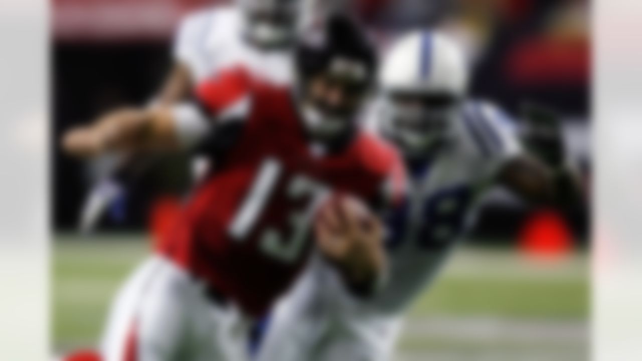 ATLANTA - NOVEMBER 22: Quarterback Joey Harrington #13 of the Atlanta Falcons runs past Robert Mathis #98 of the Indianapolis Colts at the Georgia Dome November 22, 2007 in Atlanta Georgia. (Photo by Chris Graythen/Getty Images)