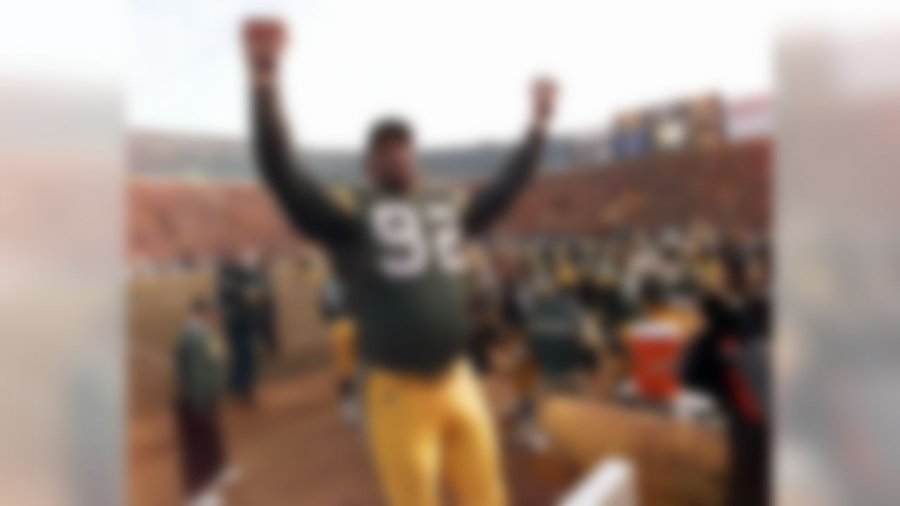 Green Bay Packers defensive end Reggie White celebrates in the closing minutes of the NFC Championship game with the Carolina Panthers Sunday, Jan. 12, 1997, in Green Bay, Wis. The Pack advances to Super Bowl XXXI after beating the Panthers 30-13. (AP Photo/Beth A. Keiser)