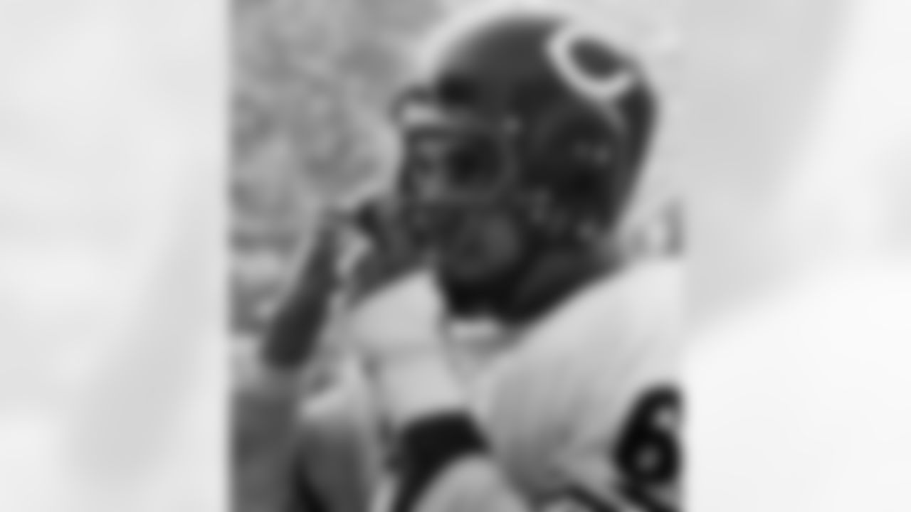Chicago Bears linebacker Bill George (61) adjusts his helmet on the sideline during game against the Los Angeles Rams in Los Angeles, Oct. 13, 1963. Bears won, 52-14. (National Football League)