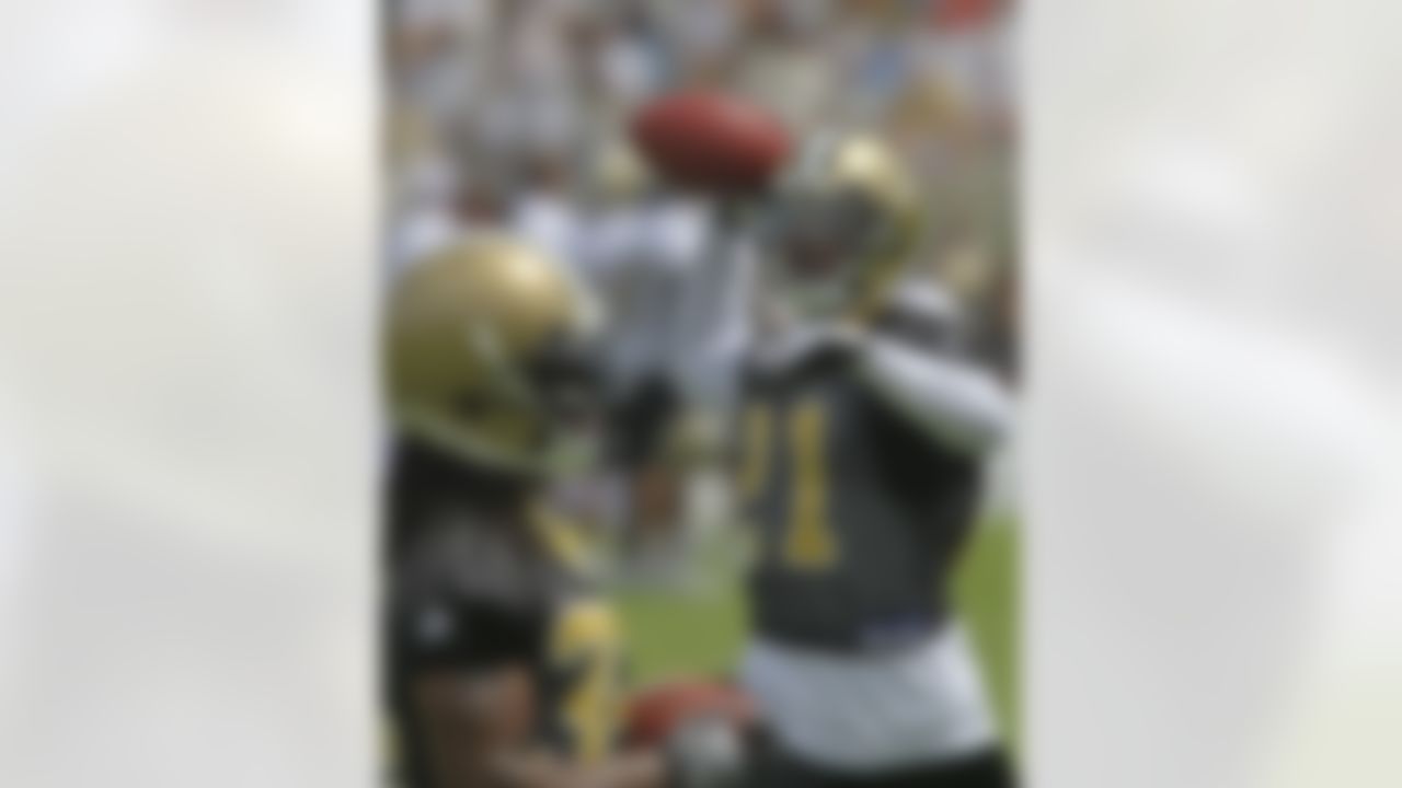 New Orleans Saints safety Chip Vaughn (21) thows a ball during minicamp at the club's NFL football training facility in Metairie, Sunday, June 6, 2010. (AP Photo/Bill Haber)