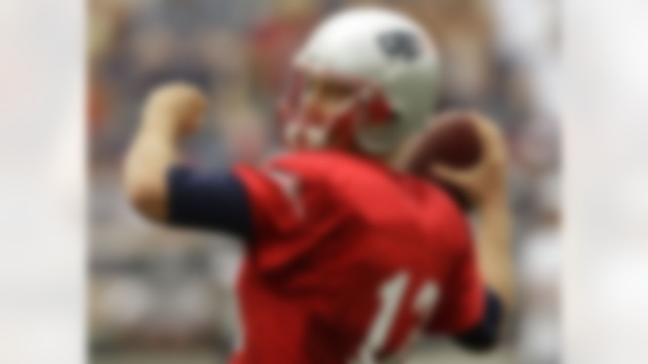 New England Patriots quarterback Tom Brady throws a pass during practice on the second day of NFL football training camp in Foxborough, Mass., Friday, July 27, 2012. (AP Photo/Stephan Savoia)