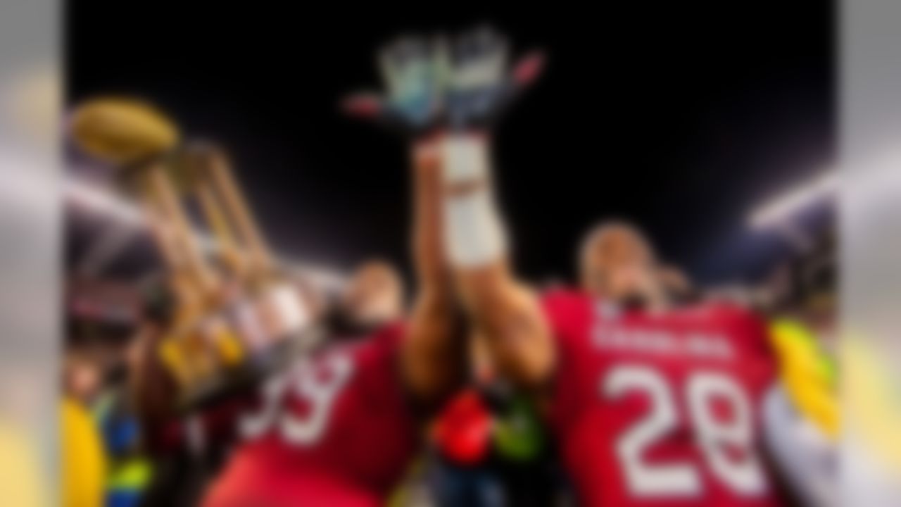 South Carolina Gamecocks defensive tackle Kelcy Quarles (99) and South Carolina Gamecocks linebacker Jonathan Walton (28) celebrate with the Hardee's trophy for defeating the Clemson Tigers at Williams-Brice Stadium. (Jeff Blake/USA TODAY Sports)