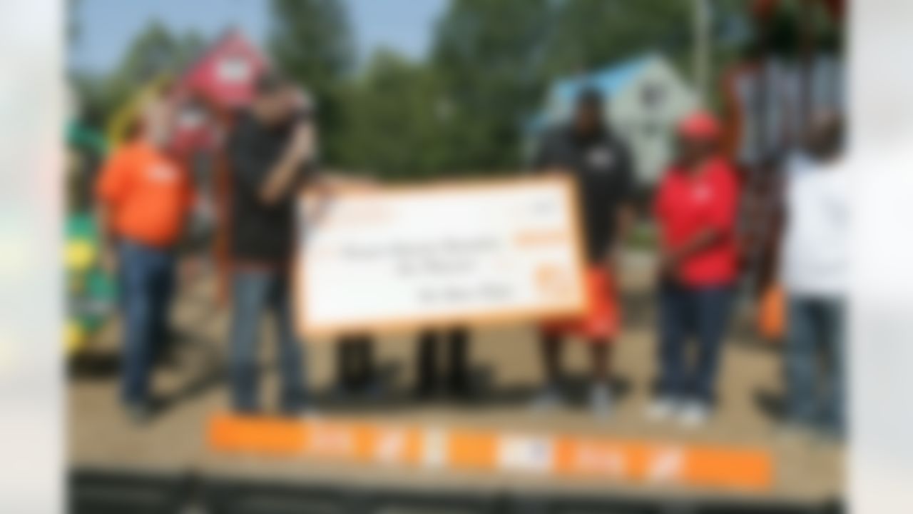 The Home Depot presents Braylon Edwards with a donation to his Foundation. (Photo by Alan Marler/CIA Stock Photography, Inc.)