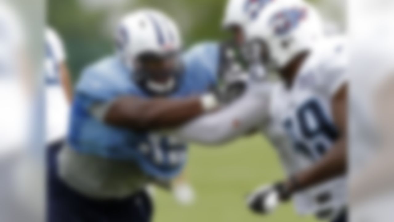 Tennessee Titans defensive end Kamerion Wimbley, left, tries to get to the quarterback during an NFL football training camp at Titans' headquarters Monday, July 30, 2012 Nashville, Tenn. (AP Photo/Wade Payne)