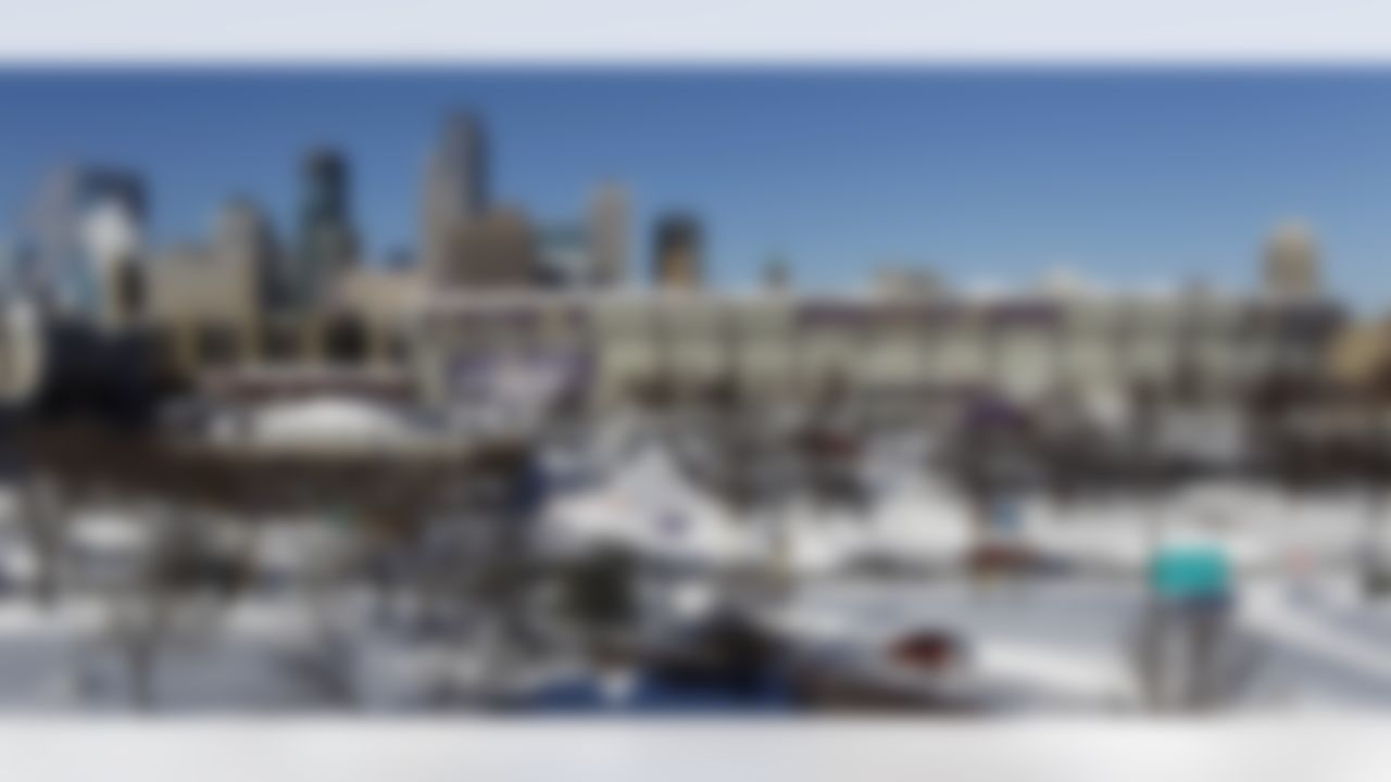 The collapsed roof of the Metrodome can be seen with the skyline behind in Minneapolis Sunday, Dec. 12, 2010. The inflatable roof of the Metrodome collapsed Sunday after a snowstorm that dumped 17 inches (43 cms) on Minneapolis. No one was hurt, but the roof failure sent the NFL scrambling to find a new venue for the Vikings' game against the New York Giants. (AP Photo/Ann Heisenfelt)