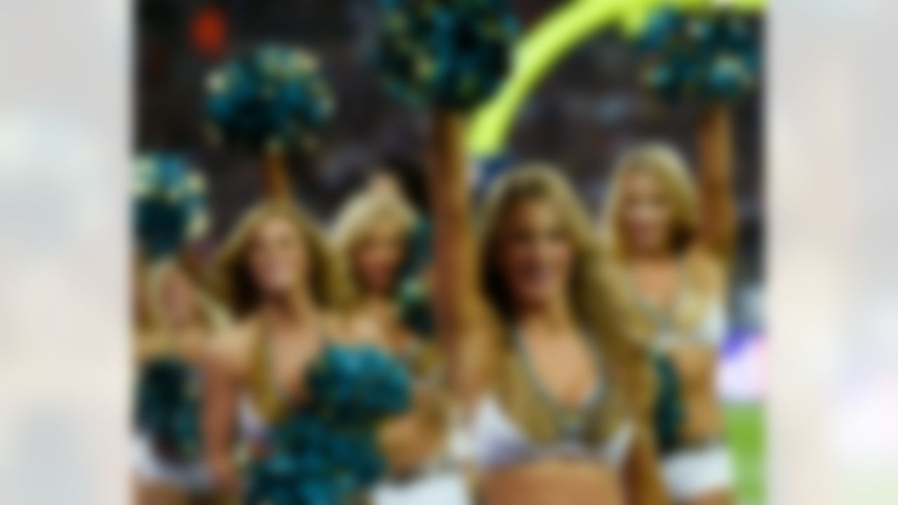 Jacksonville Jaguars cheerleaders perform during the first half of an NFL football game against the Dallas Cowboys at Wembley Stadium, London, Sunday, Nov. 9, 2014. (AP Photo/Tim Ireland)