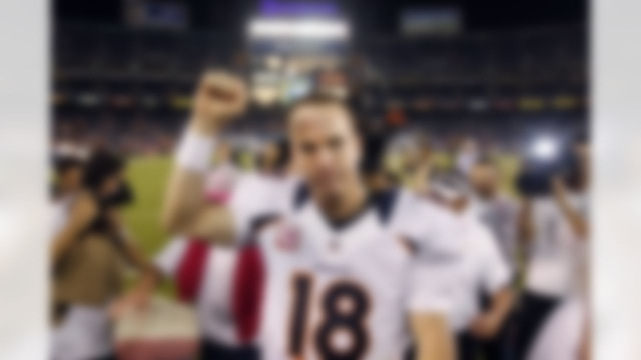 Denver Broncos quarterback Peyton Manning pumps his fist as he leaves the field following their 35-24 win over the San Diego Chargers in an NFL football game, Monday, Oct. 15, 2012, in San Diego. (AP Photo/Lenny Ignelzi)