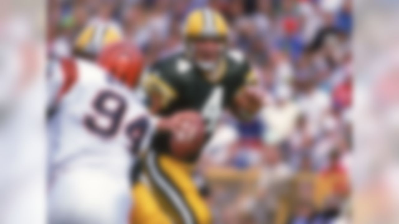 In Week 3 of the 1992 season, 22-year-old Brett Favre throws his first career touchdown pass to wide receiver Sterling Sharpe. Favre leads the Packers to a 24-23 comeback win against the Cincinnati Bengals.