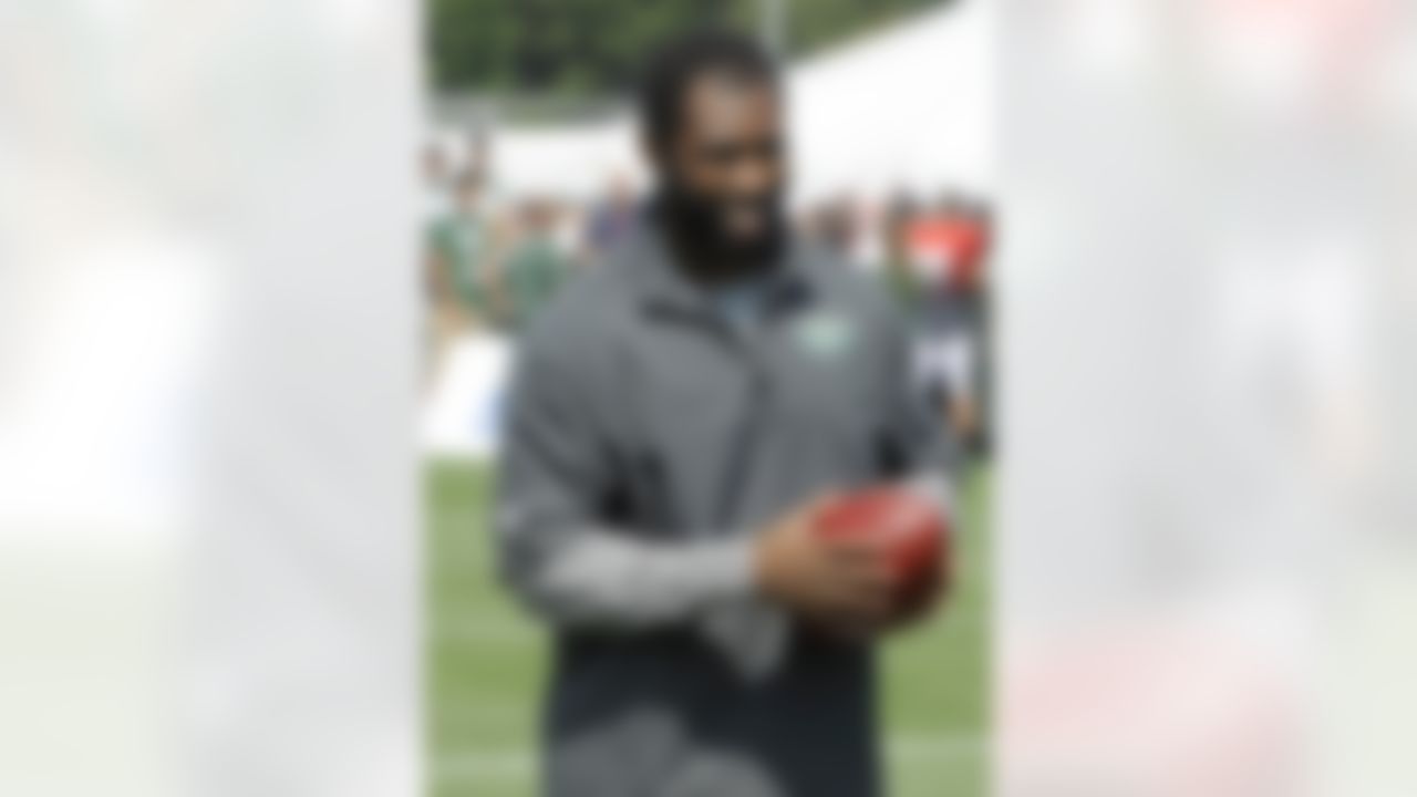 New York Jets cornerback Darrelle Revis walks off the field after practice at NFL football training camp on Sunday, July 29, 2012, in Cortland, N.Y. (AP Photo/Bill Kostroun)