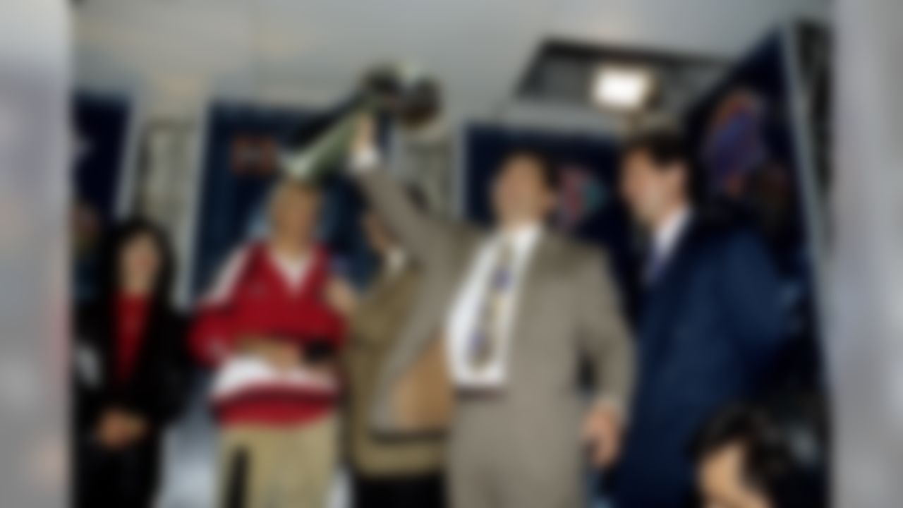 San Francisco 49ers owners Denise DeBartolo York (second from left) and Edward DeBartolo Jr. accept the Vince Lombardi Trophy from NFL Commissioner Paul Tagliabue following Super Bowl XXIX, a 49 - 26 victory over the San Diego Chargers on January 29, 1995, at Joe Robbie Stadium in Miami, Florida. Also present are head coach George Siefert, ABC sports reporter Brent Musburger, and general manager Carmen Policy. (Al Messerschmidt via AP)