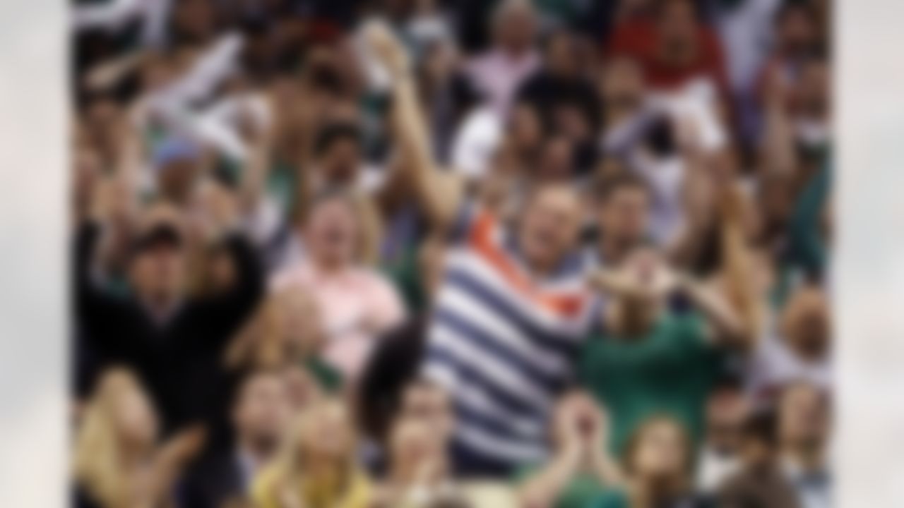 June 3, 2012; Boston, MA, USA; New England Patriots player Rob Gronkowski reacts from his seat behind Patriots head coach Bill Belichick in overtime as the Boston Celtics take on the Miami Heat in game four of the Eastern Conference finals of the 2012 NBA playoffs at TD Garden. Mandatory Credit: David Butler II-US PRESSWIRE