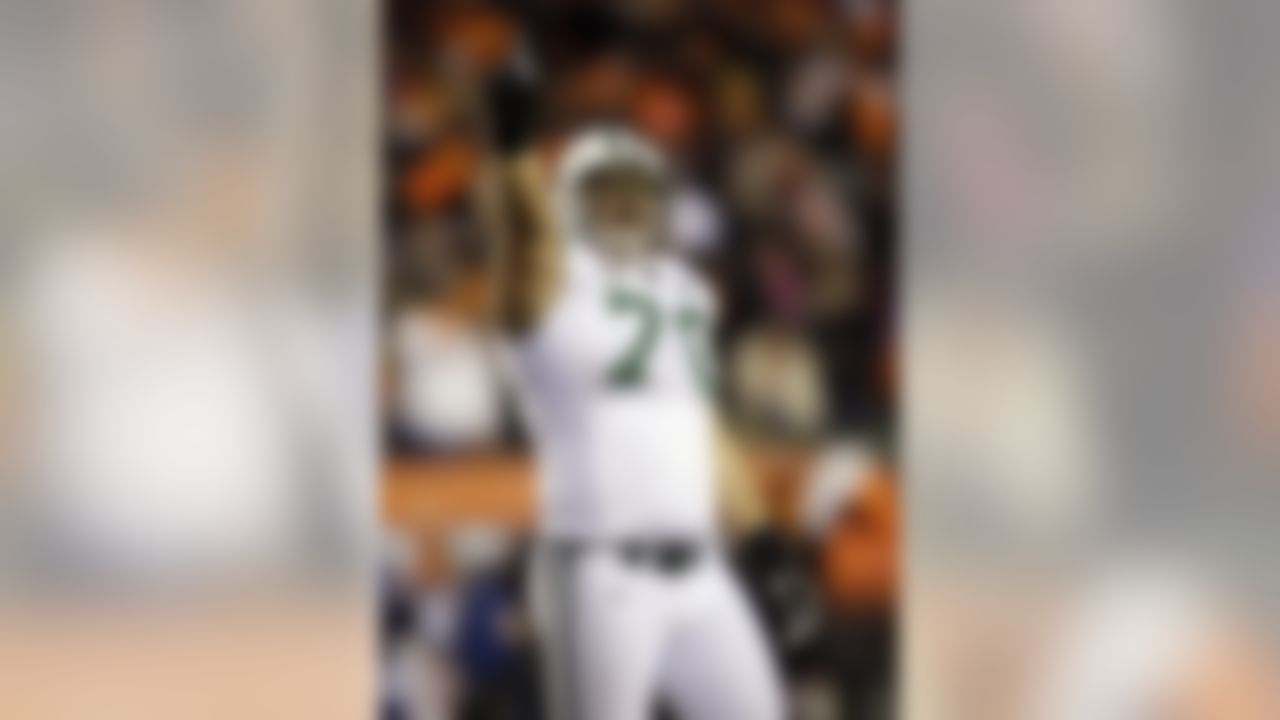 New York Jets defensive end Mike Devito (70) celebrates after the Cincinnati Bengals missed a field goal during the fourth quarter of an NFL wild-card playoff football game, Saturday, Jan. 9, 2010, in Cincinnati. The Jets won 24-14. (AP Photo/Rob Carr)