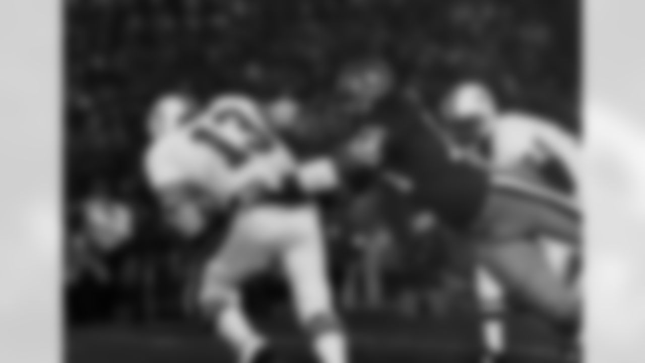 San Francisco 49ers defensive end Dwaine Board (76) sacks Miami Dolphins quarterback Dan Marino (13) for a 9 yard loss during the Super Bowl XIX at Stanford Stadium in Stanford, CA on January 20, 1985. (National Football League)