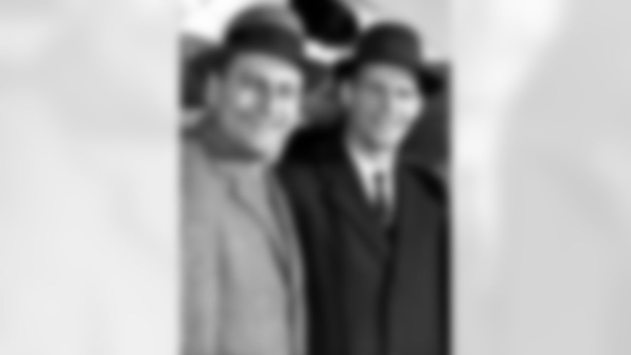 Tom Landry, right, is greeted at the airport in Dallas by Dallas Cowboys general manager Tex Schramm, in this Dec. 28, 1959 photo. (Associated Press)