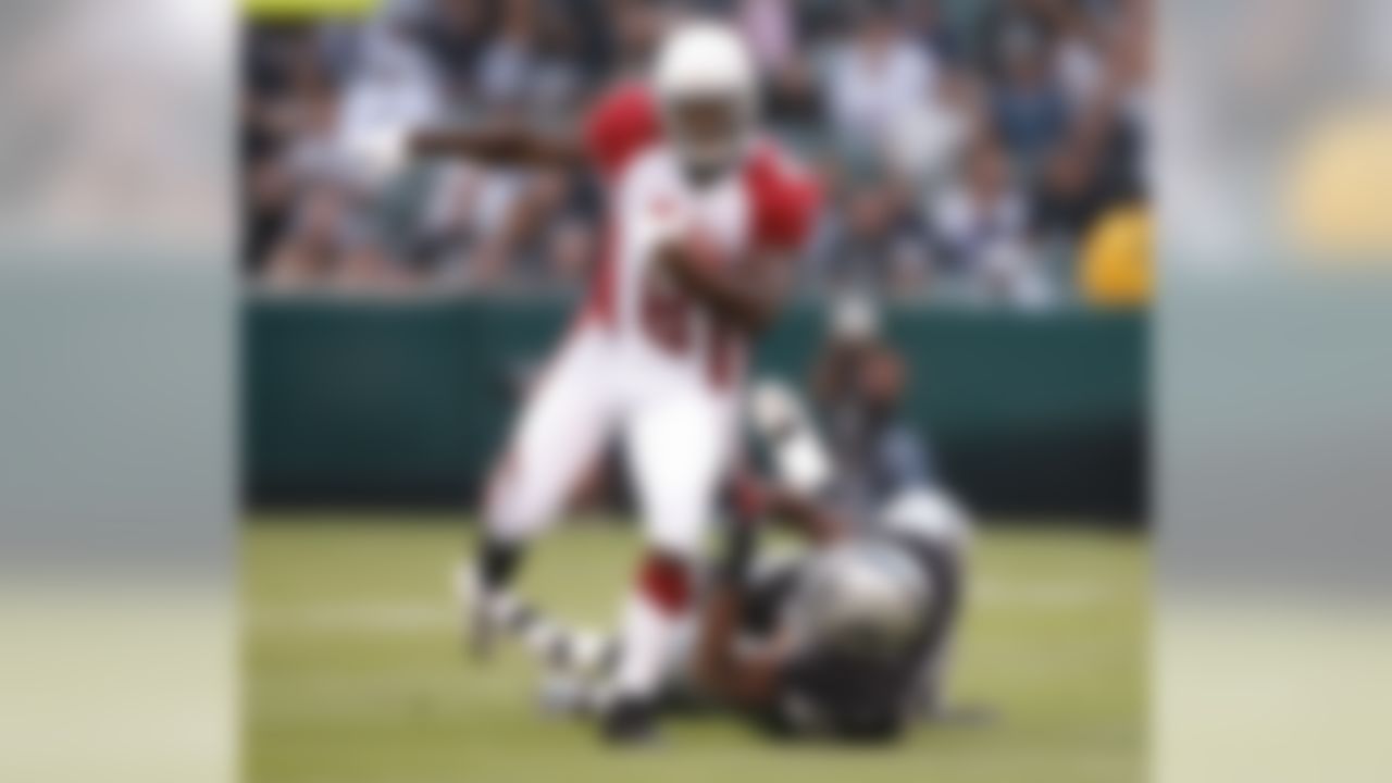 OAKLAND, CA - AUGUST 11: Wide receiver Anquan Boldin #81 of the Arizona Cardinals drags an Oakland Raiders defender on August 11, 2007 at McAfee Stadium in Oakland, California. (Photo by Greg Trott/Getty Images)