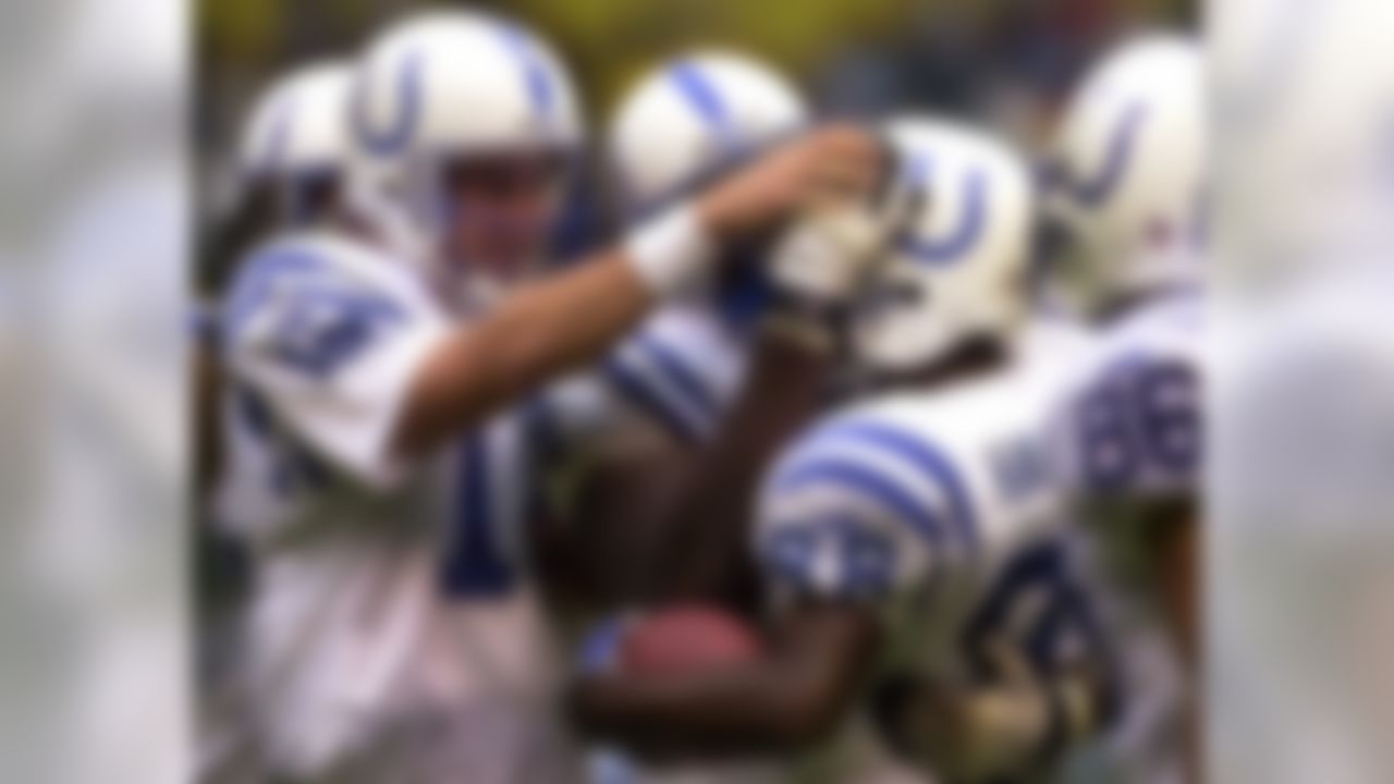 Indianapolis Colts quarterback Peyton Manning, left, congratulates teammate Marvin Harrison, right, after they connected for a 77-yard reception in their preseason game against the Pittsburgh Steelers Saturday, Aug. 19, 2000, in Mexico City. (AP Photo/Gregory Bull)