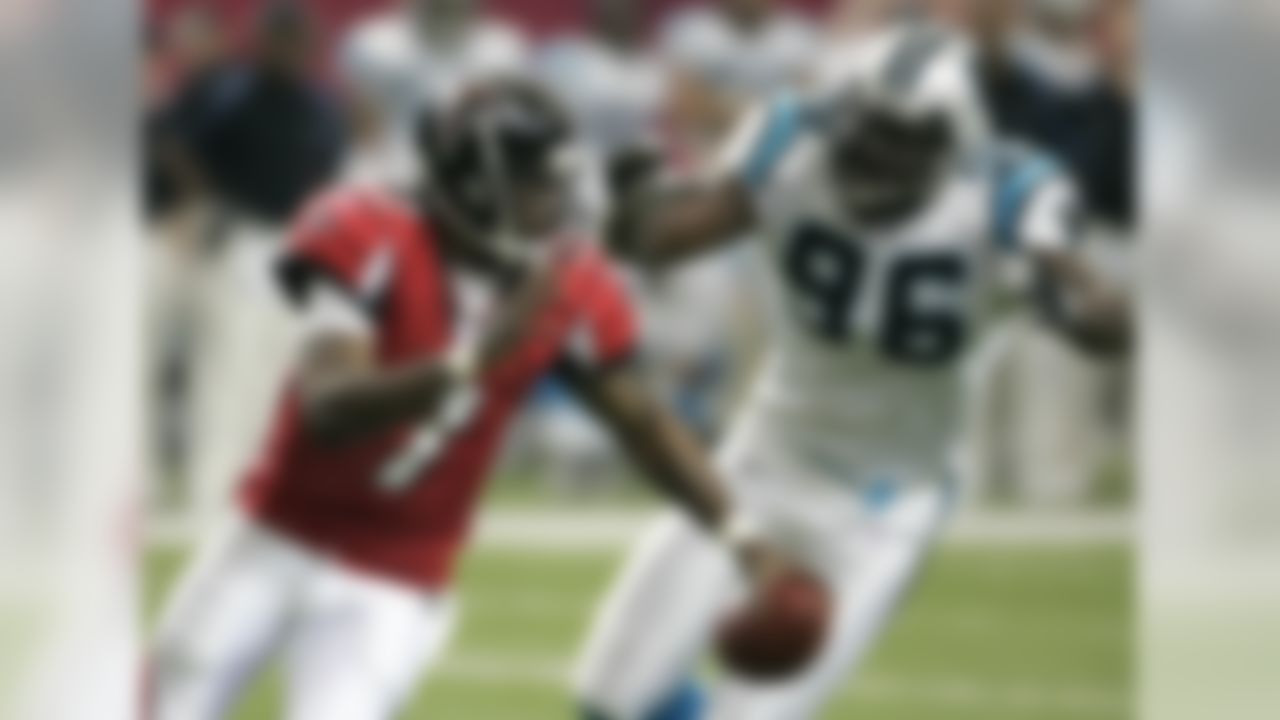 Carolina Panthers' Al Wallace (96) runs down Atlanta Falcons quarterback Michael Vick (7) during second-half NFL action in Atlanta, Sunday, Jan. 1, 2006. Carolina won, 44-11. (AP Photo/Bill Haber)
