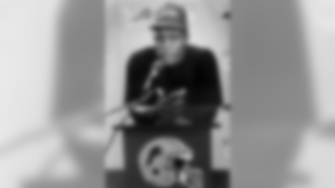 FILE--Detroit Lions first round draft pick Barry Sanders appears during a news conference after signing his first NFL contract at the Pontiac Silverdome in Pontiac, Mich., in 1989. Sanders is quitting football, despite the near certainty of becoming the NFL's career rushing leader this season. "My desire to exit the game is greater than my desire to remain in it. I have searched my heart through and through and feel comfortable with this decision," Sanders said in a statement released Wednesday, July 28, 1999. (AP Photo/John Stormzand, File)