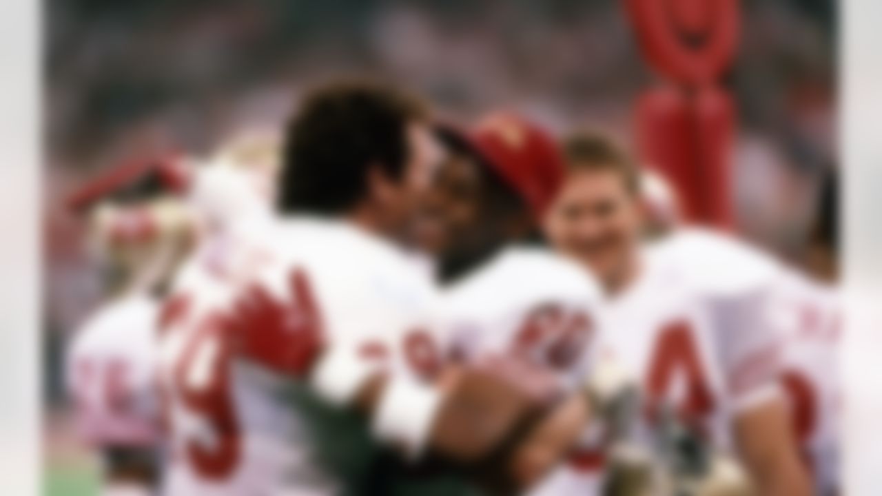 San Francisco 49ers guard Bruce Collie (69) and Hall of Fame wide receiver Jerry Rice (80) celebrate after winning Super Bowl XXIV Jan. 28, 1990, at the Louisiana Superdome in New Orleans. The 49ers defeated the Broncos 55�10. (AP Photo/Tony Tomsic)