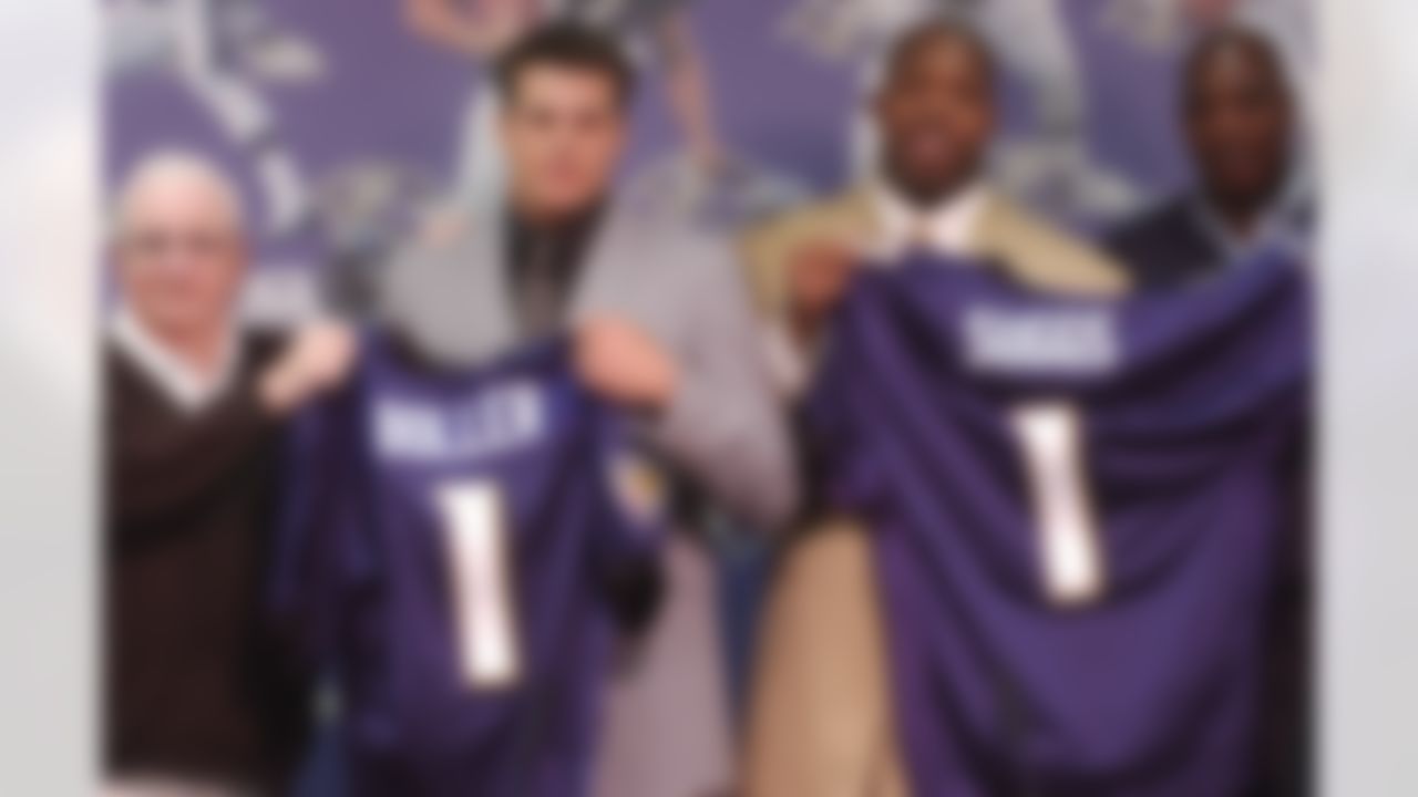 Baltimore Ravens, left to right, owner Art Modell, second round draft pick from California quarterback Kyle Boller, first round draft pick from Arizona State defensive end Terrell Suggs and Ravens general manager Ozzie Newsome stand with jerseys during a news conference Sunday, April 27, 2003 in Owings Mills, Md. (AP Photo/Gail Burton)