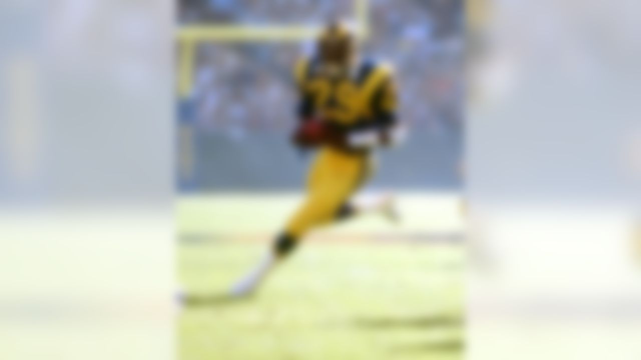 Los Angeles Rams Hall of Fame running back Eric Dickerson (29) runs upfield during an NFL game against the Chicago Bears, Nov. 11, 1984. The Rams defeated the Bears 29-13 at Anaheim Stadium. (National Football League)