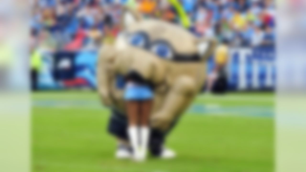 The Tennessee Titans mascot swallows a Titans cheerleader during a timeout at LP Field. (Don McPeak-USA TODAY Sports)