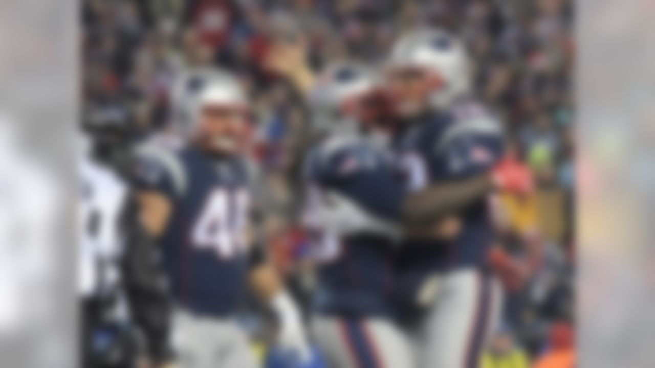 New England Patriots running back LeGarrette Blount (29) celebrates with quarterback Tom Brady (12) after scoring on a 1-yard touchdown run in the second quarter against the Baltimore Ravens during a NFL football game in Foxboro, Mass. on Monday, Dec. 12, 2016. (Kirby Lee/NFL)