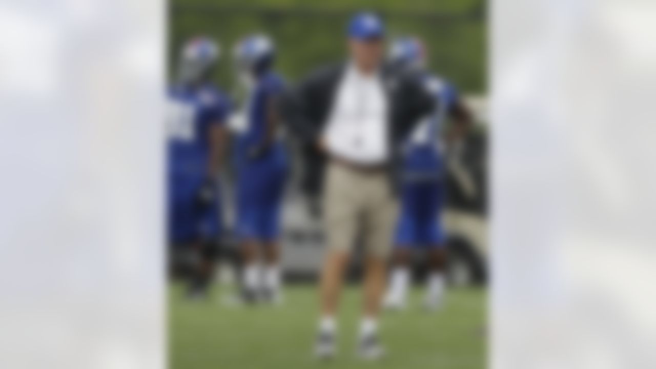 New York Giants head coach Tom Coughlin watches his team, the defending Super Bowl Champions, practice at the New York Giants NFL football training camp in Albany, N.Y., Saturday, July 28, 2012. (AP Photo/Kathy Willens)
