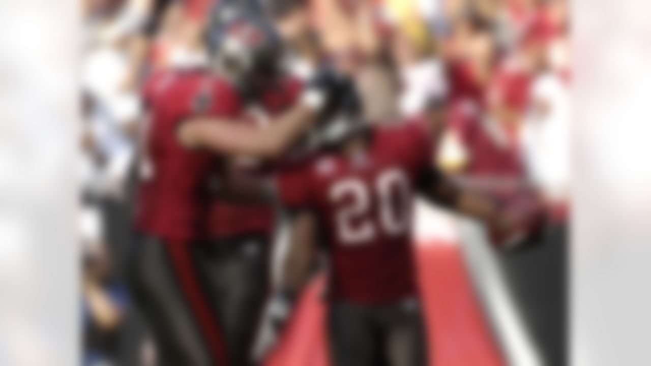 TAMPA, FL - NOVEMBER 25: Cornerback Rhonde Barber #20 of the Tampa Bay Buccaneers celebrates an interception against the Washington Redskins at the Raymond James Stadium November 25, 2007 in Tampa, Florida. The Bucs won 19-13. (Photo by Al Messerschmidt/Getty Images)