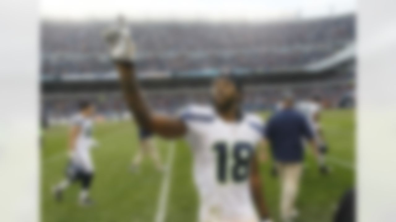 Seattle Seahawks wide receiver Sidney Rice (18) leaves the field after scoring the winning touchdown in the Seahawks' 23-17 overtime win over the Chicago Bears in an NFL football game in Chicago, Sunday, Dec. 2, 2012. (AP Photo/Charles Rex Arbogast)