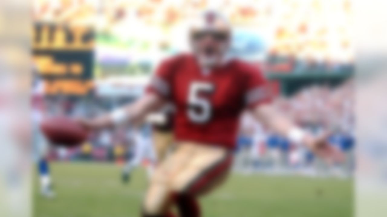 San Francisco 49ers Jeff Garcia reacts after he scored a touchdown in the fourth quarter during the San Francisco 49ers vs. New York Giants NFC Wild Card playoff game in San Francisco, Sunday, Jan. 5, 2003. (AP Photo/Ben Margot)
