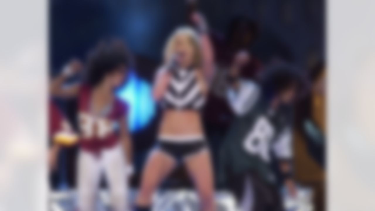 Britney Spears performs on the Mall in Washington during "NFL Kickoff Live 2003," Thursday, Sept. 4, 2003, in Washington. (AP Photo/Gerald Herbert)
