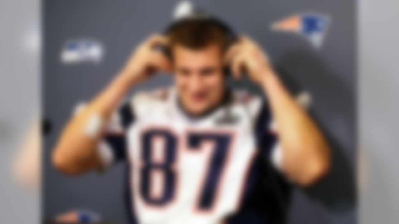New England Patriots tight end Rob Gronkowski puts on headphones to hear a question during a news conference Thursday, Jan. 29, 2015, in Chandler, Ariz. The Patriots play the Seattle Seahawks in NFL football Super Bowl XLIX Sunday, Feb. 1. (AP Photo/Mark Humphrey)