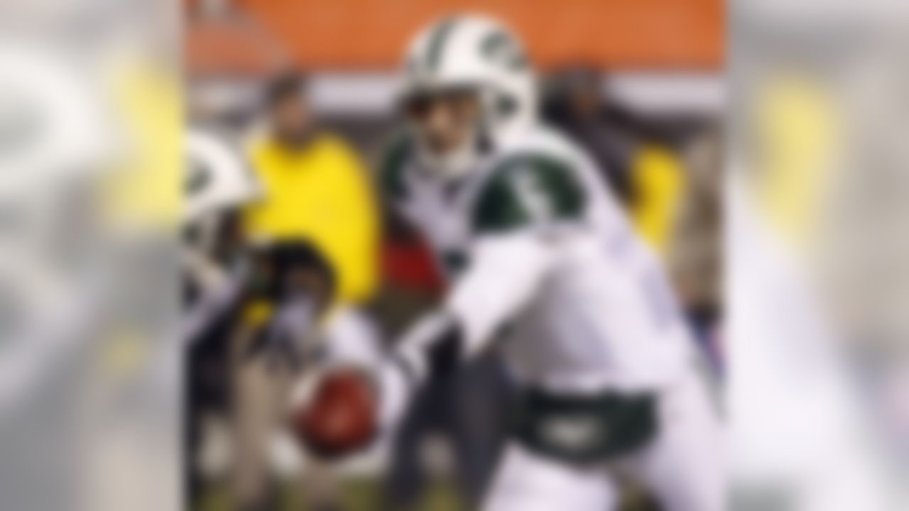 New York Jets quarterback Mark Sanchez (6) hands off in the second half of an NFL wild-card playoff football game against the Cincinnati Bengals, Saturday, Jan. 9, 2010, in Cincinnati. New York won 24-14. (AP Photo/Ed Reinke)