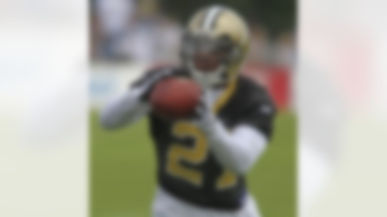 New Orleans Saints safety Chip Vaughn (21) catches a ball during minicamp at the club's NFL football training facility in Metairie, Sunday, June 6, 2010. (AP Photo/Bill Haber)