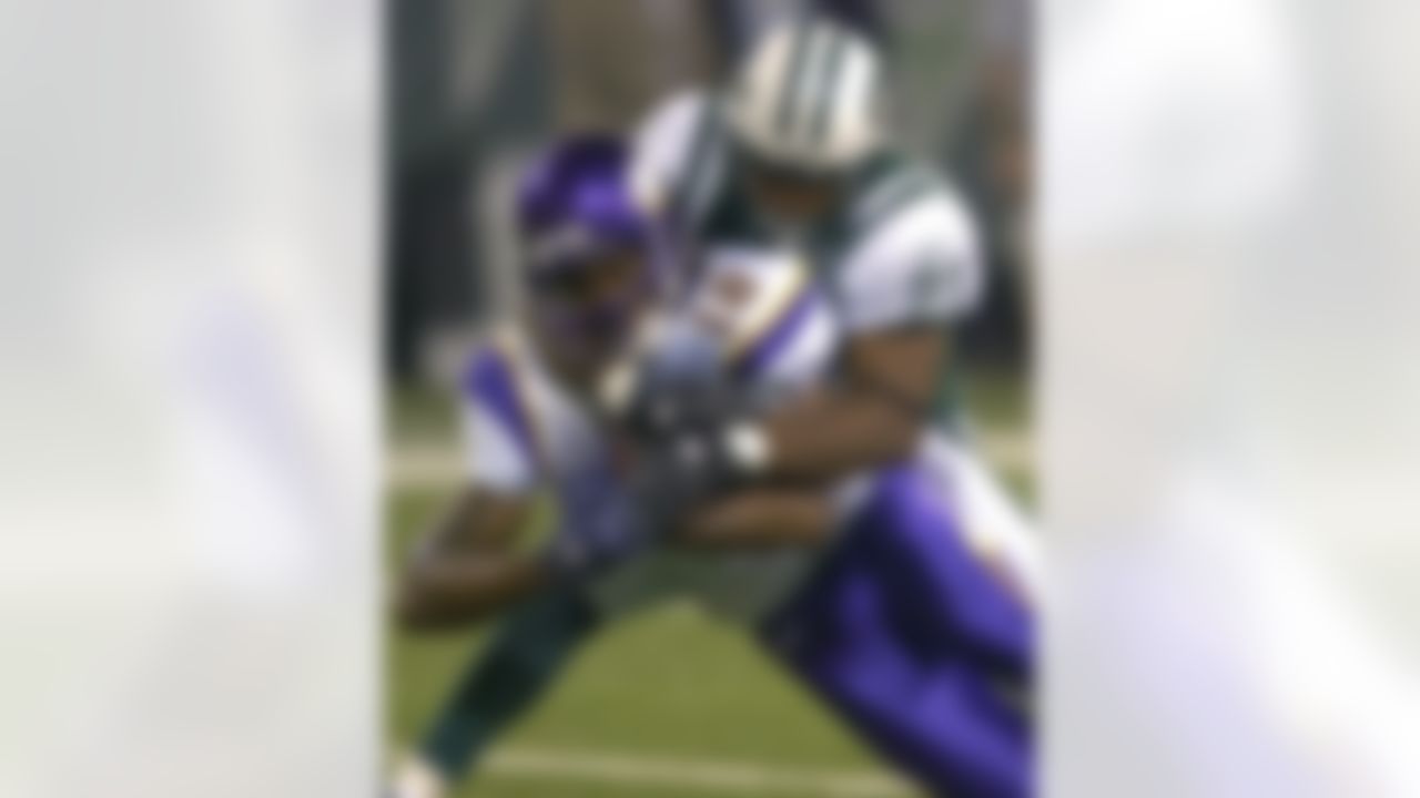 Minnesota Vikings wide receiver Sidney Rice (18) is tackled by New York Jets cornerback Andre Dyson during second quarter NFL pre-season football Friday night, Aug. 17, 2007 at Giants Stadium in East Rutherford, N.J. (AP Photo/Bill Kostroun)