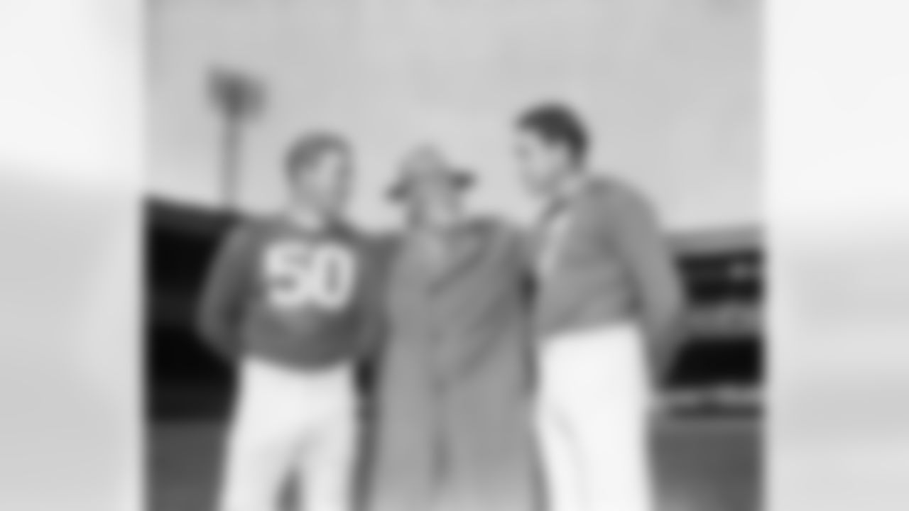 Coach Steve Owen (center), of the New York Giants football team, talks with two of the Giant's old reliables, Ken Strong (left) and Mel Hein (right), during a practice session on Oct. 11, 1945 in New York City. For their opening game of the season Oct 14 against the Boston Tigers in Yankee Stadium. (AP Photo/ John Lindsay